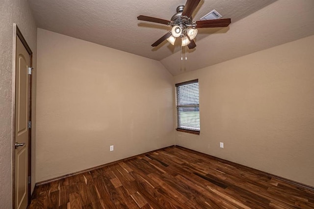 9609 Lakecrest Dr, Oklahoma City, OK 73159 - unfurnished room with lofted ceiling, a textured ceiling, dark wood-type flooring, visible vents, and ceiling fan