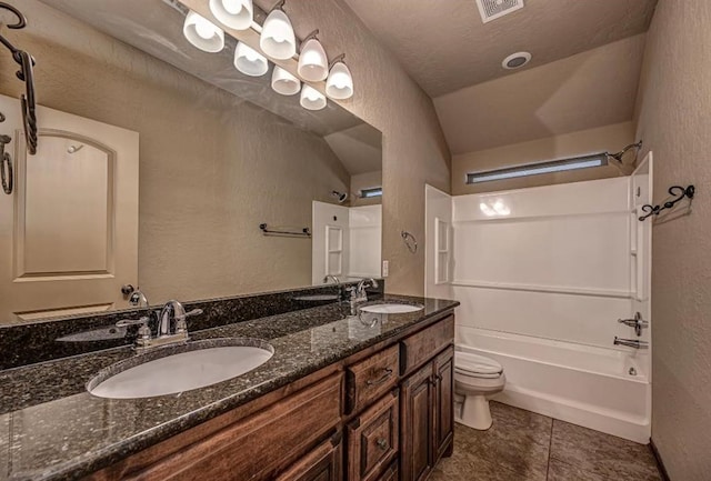 9609 Lakecrest Dr, Oklahoma City, OK 73159 - full bath featuring a textured wall, a sink, and toilet