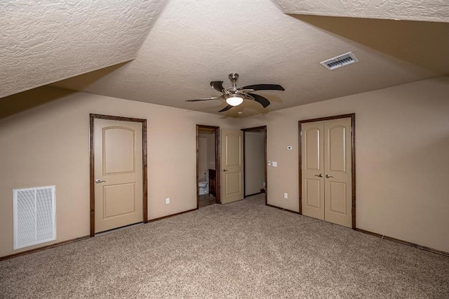 9609 Lakecrest Dr, Oklahoma City, OK 73159 - additional living space featuring a textured ceiling, ceiling fan, visible vents, and carpet floors