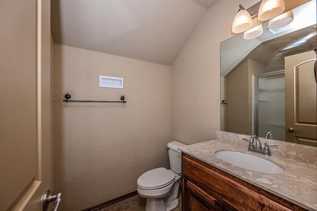 9609 Lakecrest Dr, Oklahoma City, OK 73159 - bathroom featuring a shower with shower door, vanity, visible vents, toilet, and lofted ceiling