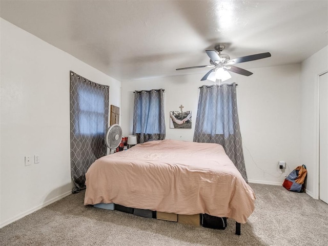 bedroom with baseboards, a ceiling fan, and carpet flooring