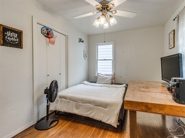 bedroom featuring wood finished floors and ceiling fan