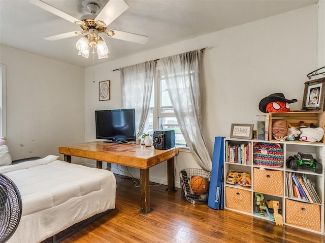 bedroom featuring ceiling fan and wood finished floors