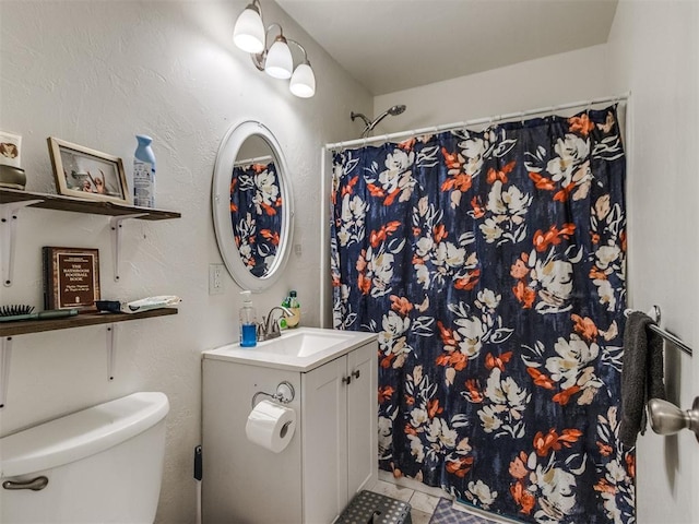 full bath featuring a shower with shower curtain, tile patterned flooring, vanity, and toilet