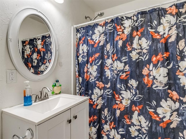 full bathroom with a shower with curtain and vanity
