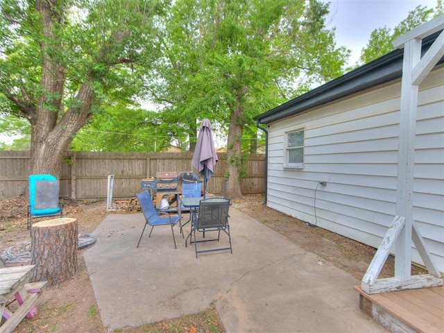 view of patio / terrace with outdoor dining space and a fenced backyard