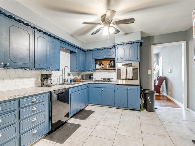 kitchen with a sink, ceiling fan, stainless steel appliances, backsplash, and blue cabinetry