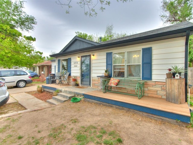 view of front of house with a wooden deck