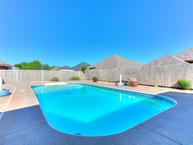 9333 SW 22nd St, Oklahoma City, OK 73128 - view of swimming pool featuring a fenced backyard, a patio area, and a fenced in pool