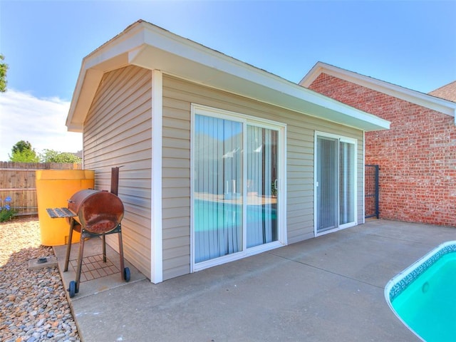 9333 SW 22nd St, Oklahoma City, OK 73128 - exterior space with a pool, fence, a patio, and brick siding