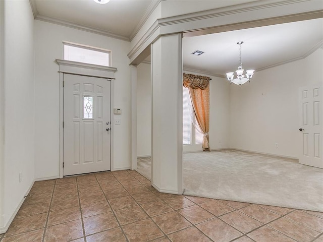 9333 SW 22nd St, Oklahoma City, OK 73128 - entryway featuring visible vents, a chandelier, light colored carpet, ornamental molding, and light tile patterned floors