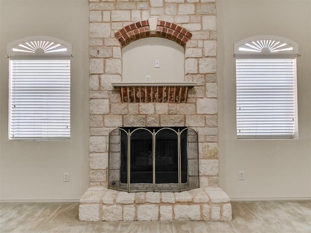9333 SW 22nd St, Oklahoma City, OK 73128 - details featuring a stone fireplace, carpet flooring, and baseboards