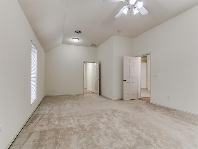 9333 SW 22nd St, Oklahoma City, OK 73128 - unfurnished bedroom with baseboards, lofted ceiling, multiple windows, and light carpet