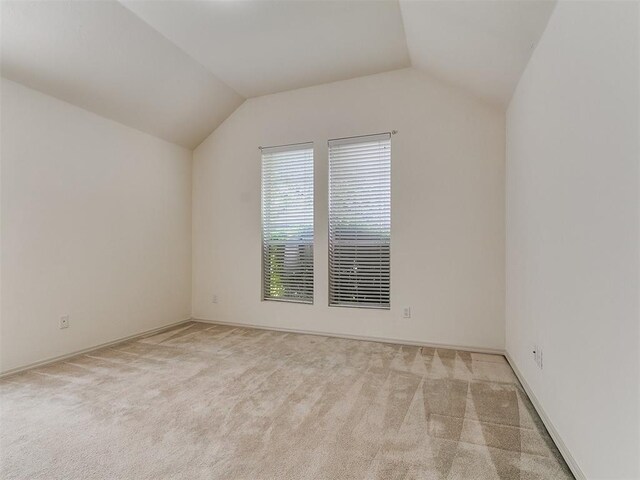 9333 SW 22nd St, Oklahoma City, OK 73128 - additional living space with lofted ceiling, baseboards, and carpet floors