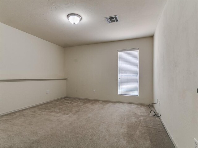 9333 SW 22nd St, Oklahoma City, OK 73128 - empty room featuring baseboards, visible vents, and carpet