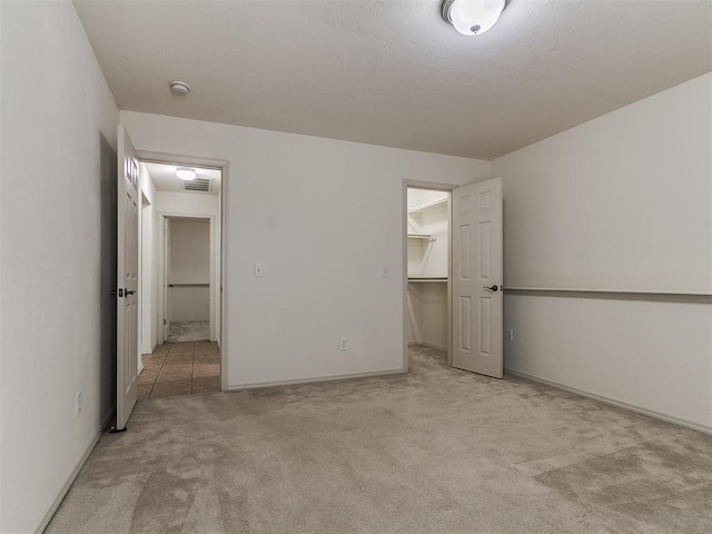 9333 SW 22nd St, Oklahoma City, OK 73128 - unfurnished bedroom with a spacious closet, visible vents, carpet floors, a closet, and baseboards