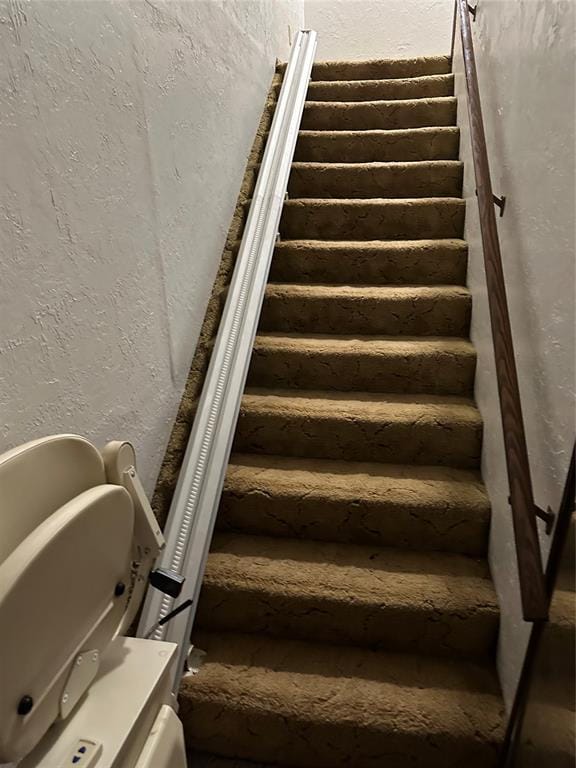 stairs with a textured wall
