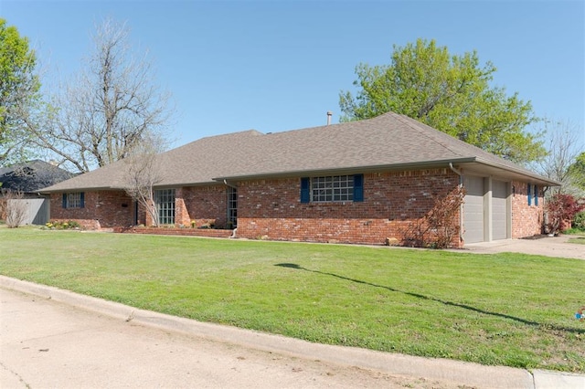 2501 NW 121st St, Oklahoma City, OK 73120 - ranch-style home featuring brick siding, a garage, a front lawn, and concrete driveway
