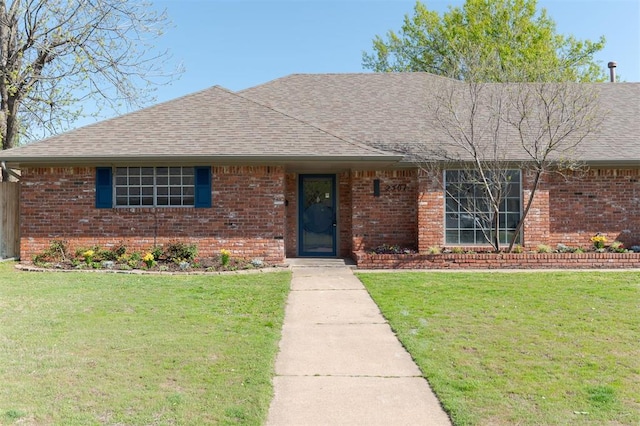2501 NW 121st St, Oklahoma City, OK 73120 - ranch-style home with brick siding, roof with shingles, and a front lawn