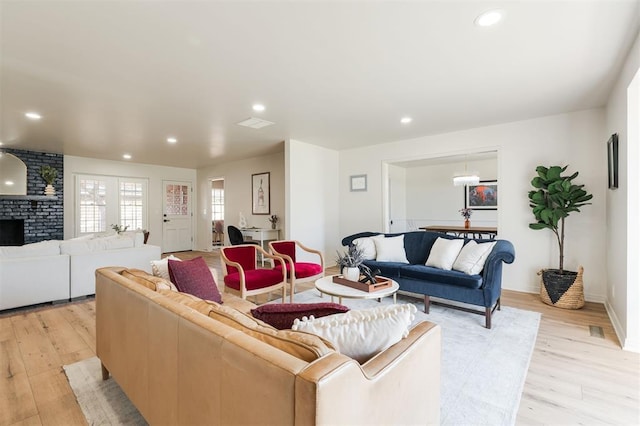 2501 NW 121st St, Oklahoma City, OK 73120 - living area featuring light wood-type flooring, recessed lighting, and a brick fireplace