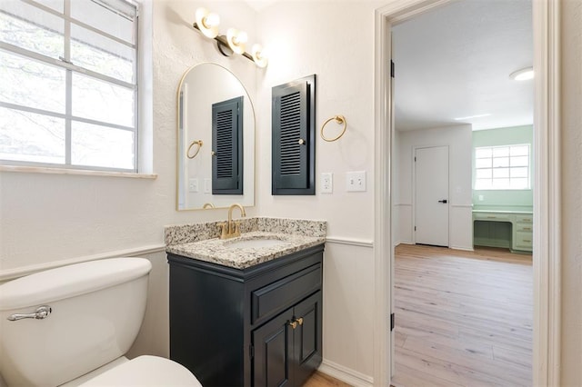 2501 NW 121st St, Oklahoma City, OK 73120 - bathroom with vanity and wood finished floors