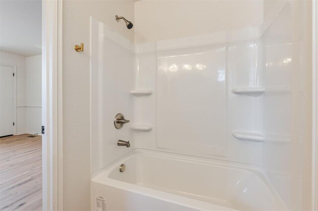 2501 NW 121st St, Oklahoma City, OK 73120 - full bath featuring shower / bathtub combination and wood finished floors
