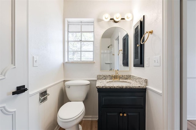 2501 NW 121st St, Oklahoma City, OK 73120 - full bathroom featuring vanity, a shower, and a wainscoted wall