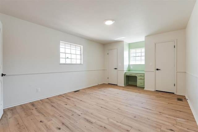 2501 NW 121st St, Oklahoma City, OK 73120 - unfurnished bedroom with light wood finished floors and baseboards