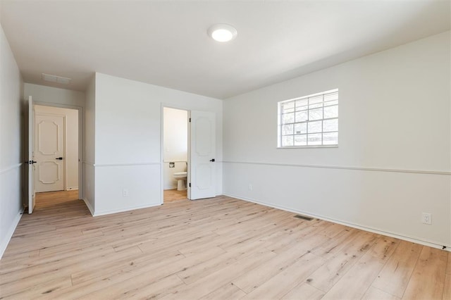 2501 NW 121st St, Oklahoma City, OK 73120 - unfurnished bedroom with light wood-style flooring and connected bathroom