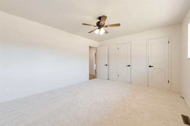 2501 NW 121st St, Oklahoma City, OK 73120 - unfurnished bedroom featuring carpet and a ceiling fan