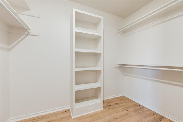 2501 NW 121st St, Oklahoma City, OK 73120 - spacious closet featuring wood finished floors