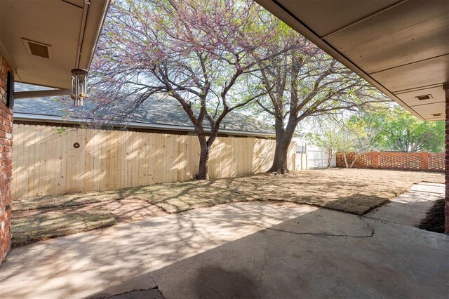2501 NW 121st St, Oklahoma City, OK 73120 - fenced backyard featuring a patio area