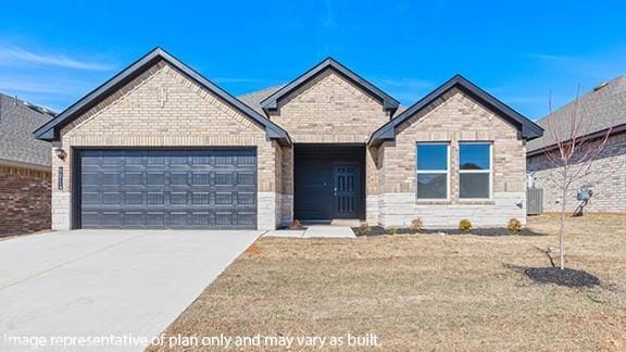 1209 E Stetson Ln, Mustang, OK 73064 - view of front of home featuring cooling unit, a garage, concrete driveway, and brick siding