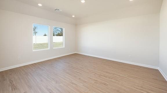 1209 E Stetson Ln, Mustang, OK 73064 - empty room featuring wood finished floors, baseboards, and recessed lighting