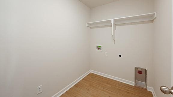 1209 E Stetson Ln, Mustang, OK 73064 - clothes washing area featuring laundry area, baseboards, hookup for a washing machine, and electric dryer hookup
