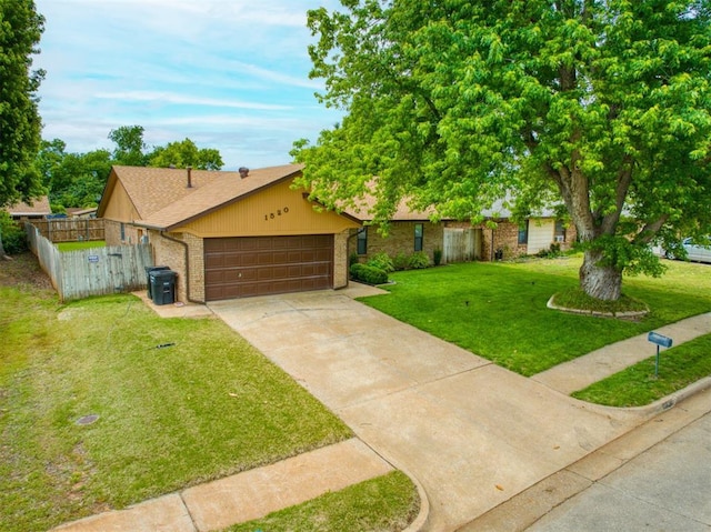 1520 NE 2nd St, Moore, OK 73160 - view of front of home featuring driveway, brick siding, fence, a garage, and a front lawn