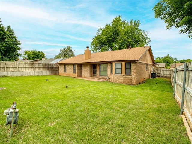 1520 NE 2nd St, Moore, OK 73160 - rear view of house featuring a chimney, brick siding, a patio, central air condition unit, and a fenced backyard