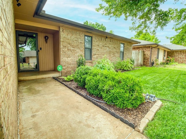 1520 NE 2nd St, Moore, OK 73160 - entrance to property featuring a yard and brick siding