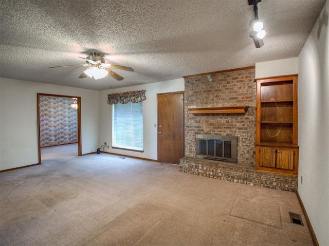 1520 NE 2nd St, Moore, OK 73160 - unfurnished living room with a textured ceiling, carpet floors, a ceiling fan, and visible vents