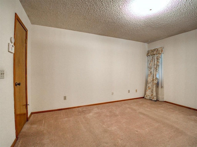 1520 NE 2nd St, Moore, OK 73160 - unfurnished room with a textured ceiling, baseboards, and light colored carpet