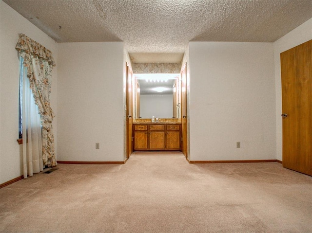 1520 NE 2nd St, Moore, OK 73160 - unfurnished bedroom with baseboards, light carpet, and a sink