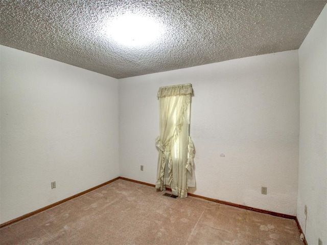 1520 NE 2nd St, Moore, OK 73160 - carpeted empty room with a textured ceiling, visible vents, and baseboards