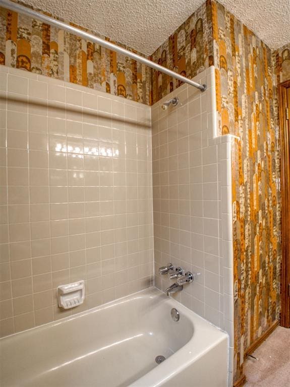 1520 NE 2nd St, Moore, OK 73160 - bathroom with a textured ceiling, bathtub / shower combination, and wallpapered walls