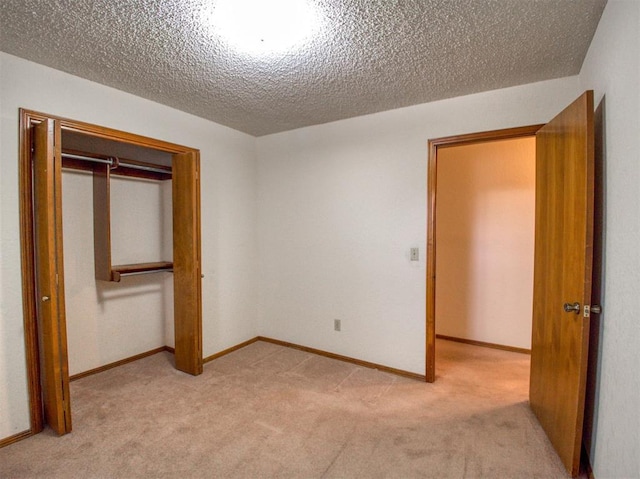 1520 NE 2nd St, Moore, OK 73160 - unfurnished bedroom featuring light colored carpet, a textured ceiling, a closet, and baseboards