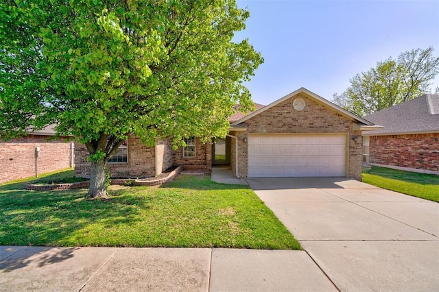 2728 SE 95th St, Moore, OK 73160 - view of front of house with a garage, brick siding, driveway, and a front lawn