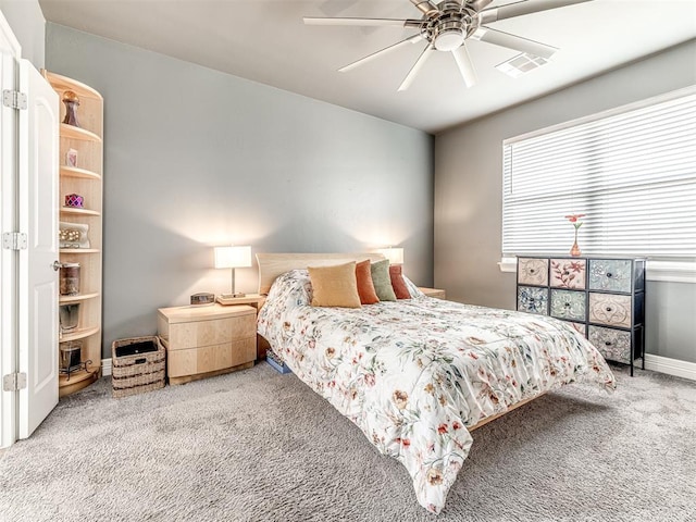bedroom featuring baseboards, carpet flooring, ceiling fan, and visible vents