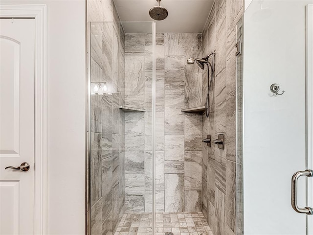 full bathroom featuring a shower stall