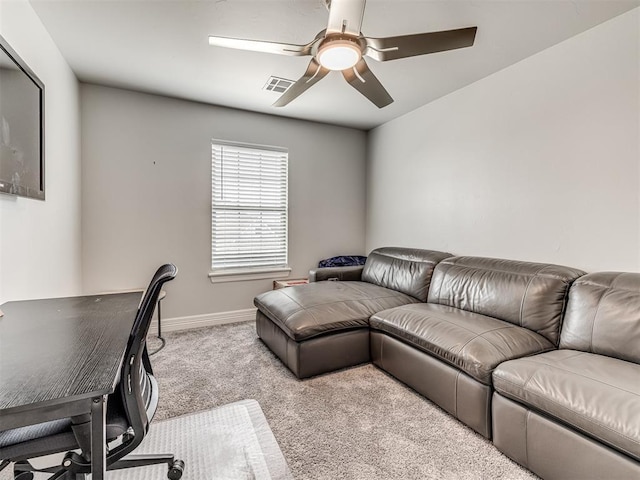 living room with visible vents, baseboards, a ceiling fan, and carpet
