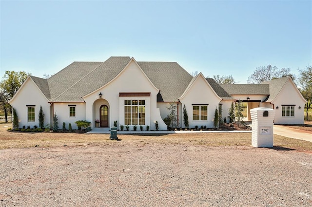 2297 Summit Cir, Blanchard, OK 73010 - french provincial home featuring a shingled roof and stucco siding