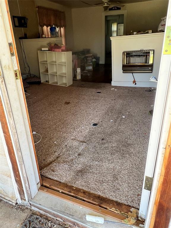 707 W Washington St, Tecumseh, OK 74873 - interior space with a ceiling fan and heating unit